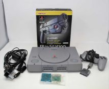 A pre-owned Sony PlayStation (SCPH-9002) with two Joytech memory cards, a Colin McRae Rally 2.0 game