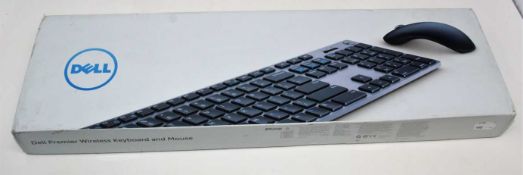 A boxed as new Dell KM717 Premier Keyboard And Mouse Set (QWERTY - UK) (Box sealed, some cosmetic