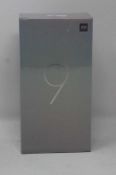 A boxed as new Xiaomi Mi 9 Global Version 6GB RAM 128GB Storage Android Smartphone in Piano Black