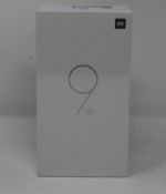 A boxed as new Xiaomi Mi 9 SE Global Version 6GB RAM 128GB Storage Android Smartphone in Piano Black