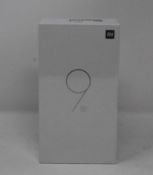 A boxed as new Xiaomi Mi 9 SE Global Version 6GB RAM 128GB Storage Android Smartphone in Piano Black