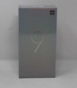 A boxed as new Xiaomi Mi 9 Global Version 6GB RAM 64GB Storage Android Smartphone in Ocean Blue