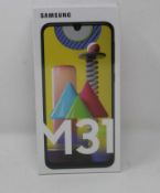 A boxed as new Samsung M31 SM-M315F/DSN 128GB in Blue (UK Plug) (Box sealed).