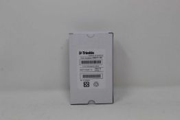 A boxed as new Trimble Rechargeable Li-Ion Battery For Robotic Total Stations (P/N: 99511-30).