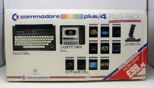 A vintage Commodore Plus/4 Plus Pack Computer with Data Cassette, Joystick, Cables, Games,