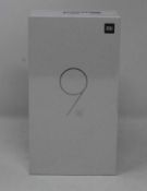 A boxed as new Xiaomi Mi 9 SE Global Version 6GB RAM 64GB Storage Android Smartphone in Piano Black