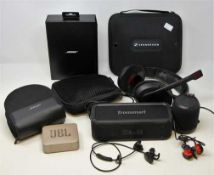 A quantity of assorted pre-owned headphones and Bluetooth speakers.