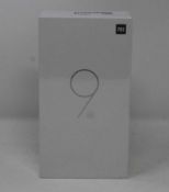 A boxed as new Xiaomi Mi 9 SE Global Version 6GB RAM 128GB Storage Android Smartphone in Piano Black