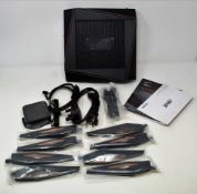 An ASUS GT-AX11000 ROG Rapture 802.11ax Tri-Band Gaming Router (No box, appears unused).