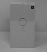 A boxed as new Xiaomi Mi 9 SE Global Version 6GB RAM 64GB Storage Android Smartphone in Piano Black