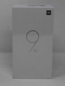 A boxed as new Xiaomi Mi 9 SE Global Version 6GB RAM 64GB Storage Android Smartphone in Piano Black