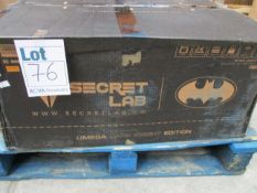 A boxed Secret Lab Omega Dark Knight Edition gaming chair.
