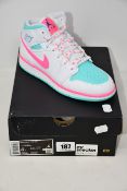 A pair of as new Nike Air Jordan 1 Mid trainers (UK 3.5).