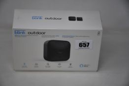 A boxed as new Blink Outdoor smart security camera system.