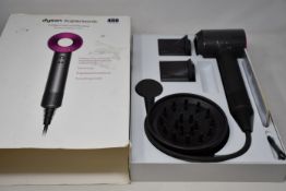 One boxed as new Dyson Supersonic hairdryer in Iron/Fuchsia (Possible display/demo model as body
