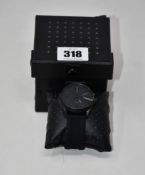 An as new Diesel DZ1892 MS9 three-hand black silicone watch.