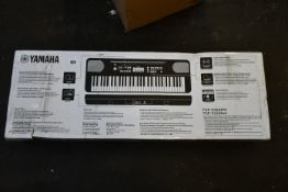 A boxed as new Yamaha PSR-E360W keyboard.
