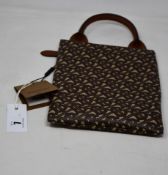 An as new Burberry handle pouch.