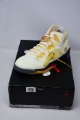 A pair of as new Nike Air Jordan 5 Retro Off White sneakers (UK 8).