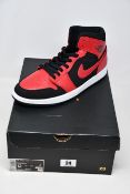 A pair of as new Nike Air Jordan 1 Mid sneakers (UK 11).