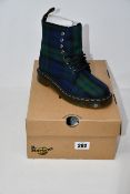 A pair of Dr Martens 1460 eight eye tartan canvas boots (UK 4) and a pair of Dr Martens 2976 Softy