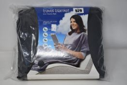 Eight Travelrest Ultrasoft travel blankets in grey.