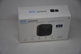 A boxed as new Blink Outdoor smart security camera system.