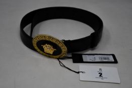 An as new Versace Medusa round buckle belt (RRP £355).