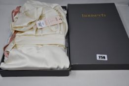 An as new House of CB London Aisha dress in ivory satin (L - RRP £129).