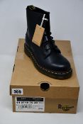 A pair of as new Dr Martens 1460 boots (UK 4).