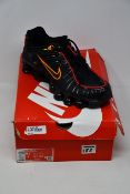 A pair of as new Nike Shox TL trainers (UK 8.5).