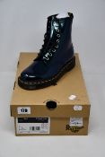 A pair of as new Dr Martens 1460 boots in teal (UK 4).