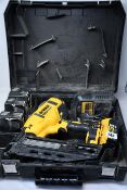 A pre-owned DeWalt angled nail gun (DCN66OP2) kit with rechargeable battery and charger.