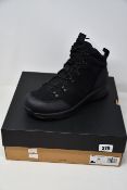 A pair of boxed as new Ugg Emmett boots in black suede (UK 9).