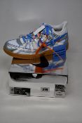A pair of as new Nike Air Rubber Dunk Off White trainers (UK 9.5).
