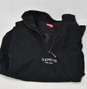An as new Supreme track half zip pullover (SS20) in black (L).