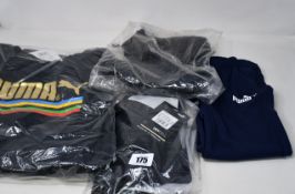 Twenty items of assorted as new Puma sportswear to include track jackets, tops, shorts and socks.