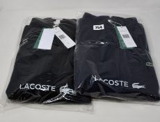 Two as new Lacoste zipped jumpers (US M - RRP £90 each).