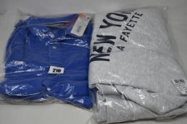 An as new Superdry City College crew sweater (UK 12-14) and four Vintage Destroyed polo shirts (2