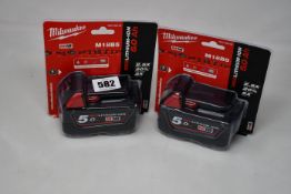 Five as new Milwaukee M18B5 batteries (Red Lithium-Ion, 5.0 Ah).