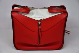 An as new Loewe small Hammock bag in red (RRP £1850).