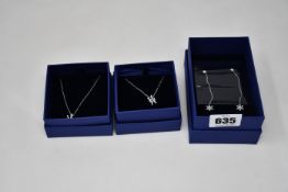 Three boxed Swarovski jewellery items to include Magic chain pierced earring (White, rhodium plated)