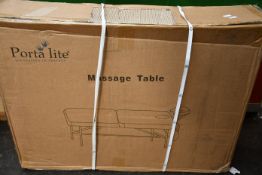 A boxed as new Porta Lite Advantage Massage Table.