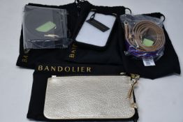 An as new Bandolier iPhone 7 case in metallic gold with matching strap and leather pouch,