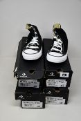 Four pairs of as new Converse All Star canvas shoes (All UK 5).