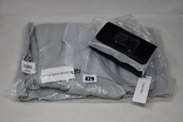 An as new Calvin Klein Jeans hoodie (S) and a Calvin Klein Signature belt bag.