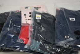 Six items of as new Under Armour sportswear; Performance 2.0 Colour Block golf polo shirt (RRP £36),