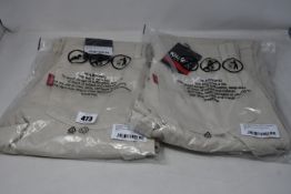 Two pairs of men's as new Kickers utility trousers in sand (Both 30 - RRP £60 each).