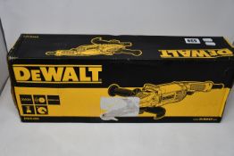 A boxed Dewalt DWE490 angle grinder.