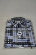 An as new Burberry check shirt in sky blue (M).